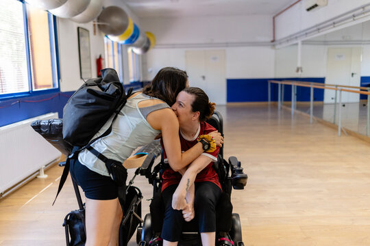 Disabled woman performing Paralympic sport with the help of equipment