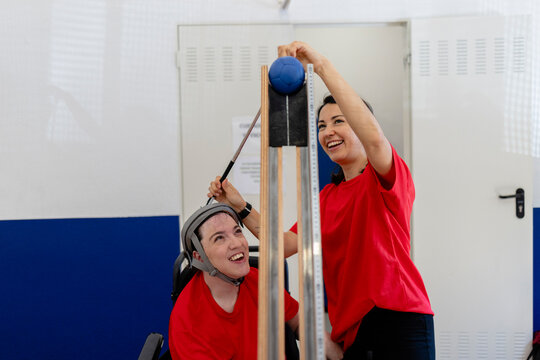 Women enjoying adaptive sport game learning physics