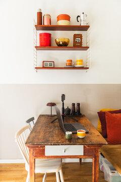 Cozy Home Office Table Setup with Laptop