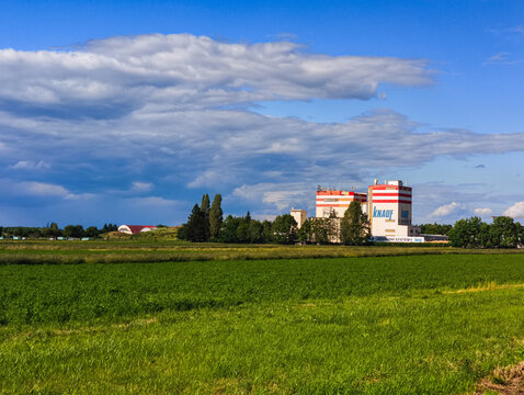 Prague, Czech republic - June 14, 2026: Knauf building near green field in prague under sky