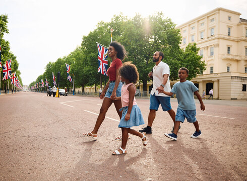 Parents walk with their kids on the streets in London
