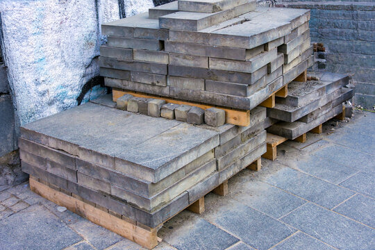 Old  dirty used refurbished construction material pile outside on a street
