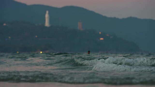 Lady Buddha statue and Linh Ung Pagoda above coastline with sea waves and mountains in Da Nang, Coastal landscape with ocean waves and Son Tra Peninsula, Danang Vietnam 4k