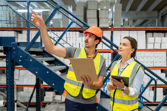 Warehouse workers checking inventory and logistic management