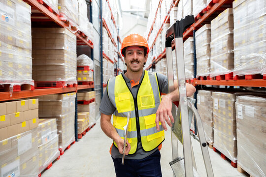 Warehouse worker managing inventory in distribution center