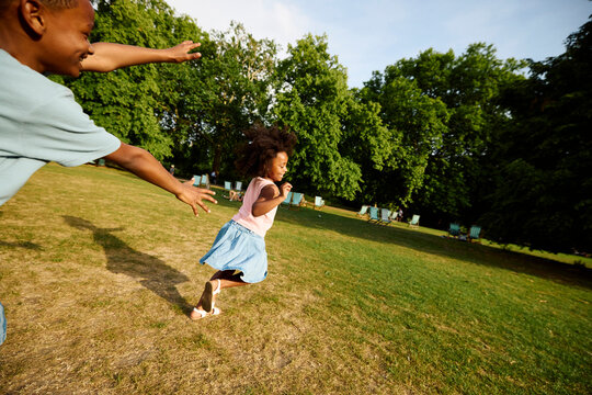 Children are playing tag in the park