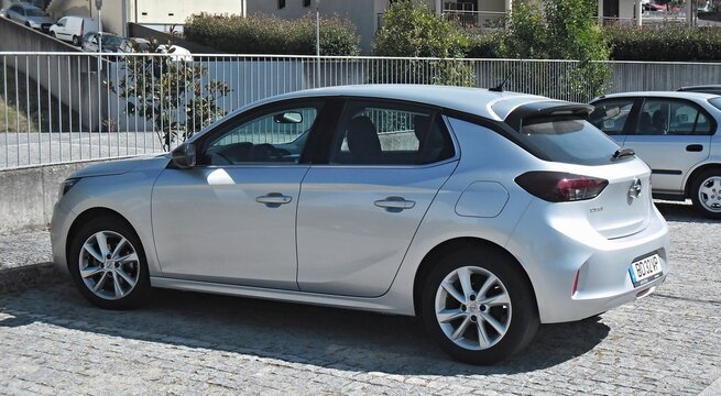 Opel Corsa silver compact car parked outdoors