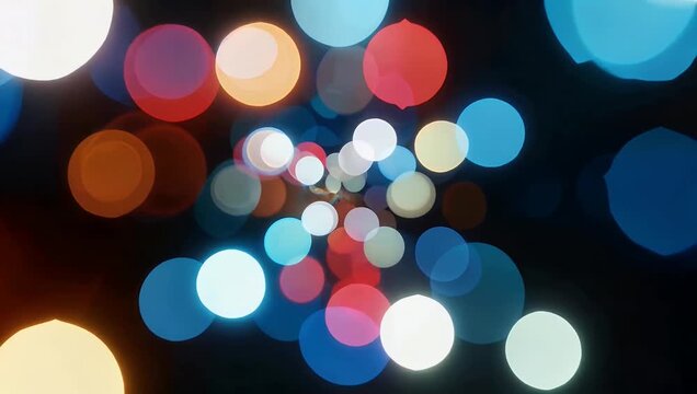 Dreamy seamless 4K background loop featuring beautiful out of focus cobalt scarlet and ivory light orbs floating gently in the dark generating a highly versatile elegant and modern cinematic visual