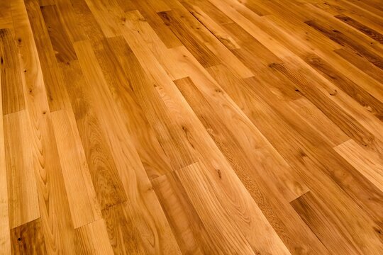 Golden amber hardwood floor parquet texture seamless background