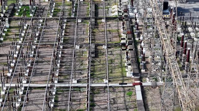Aerial view of power station with rows of transformers