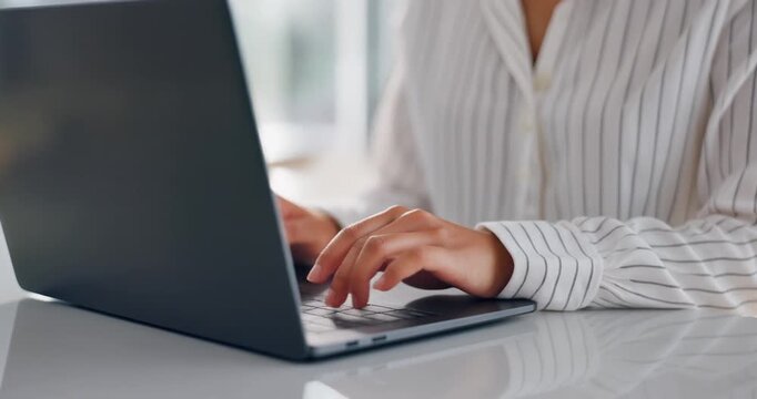 Close-up of Woman Hands Typing on Laptop Keyboard in Bright Modern Office