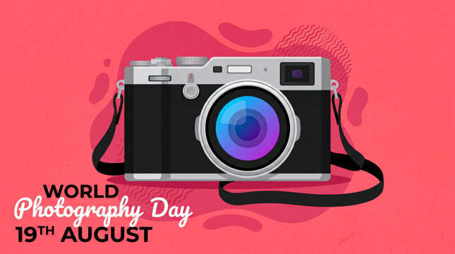 Vintage camera with blurred colorful background celebrating world photography day