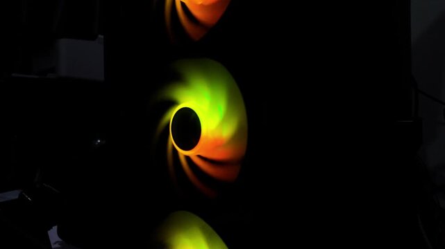 RGB Computer Cooling Fans Color Cycling in Dark Gaming Setup