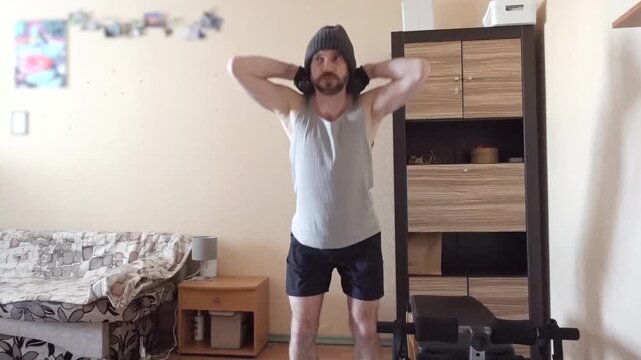 Active Mid Adult Man Doing Dumbbell Upright Row Shoulder Workout in Living Room
