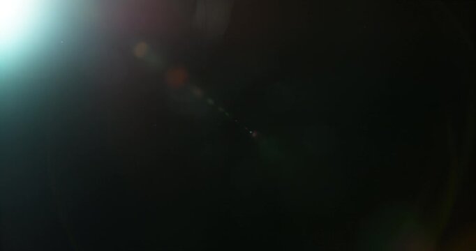 Slow motion cinematic lens flare and light leak effect isolated on black background. Perfect overlay for VFX, transitions, title reveals, film burn style and glow highlights.