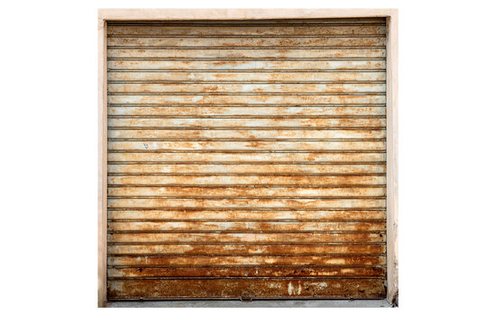 Old weathered and rusted metal roller shutter door of a garage or shop. Grunge industrial background texture with heavy rust corrosion on iron surface. Isolated on white with clipping path
