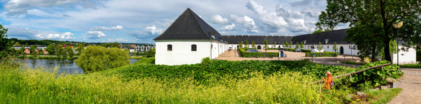 Panoramic view of historic stables of Koldinghus with , lake and green landscape