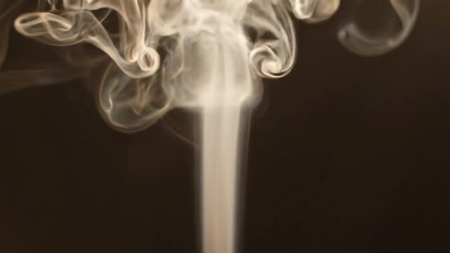 Ethereal White Smoke Wisps Rising and Swirling Slowly Against a Dark Atmospheric Background
