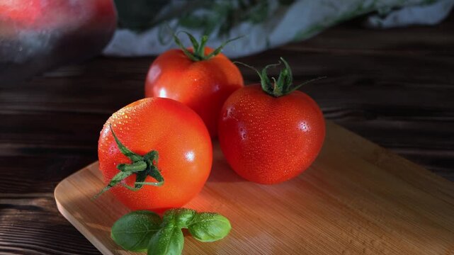 Fresh Ripe Tomatoes with Basil on Wooden Cutting Board