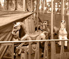 White ponies on an abandoned carousel © Marina