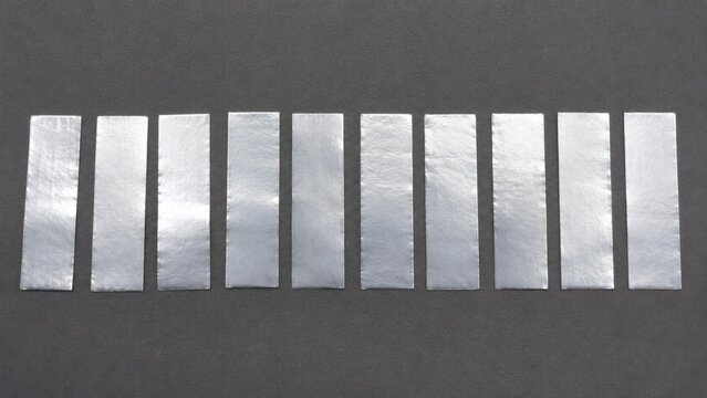 Symmetrical Row of Pure Soft Indium Metal Strip Tabs