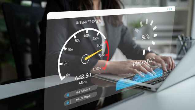 A person tests their internet speed on a modern digital interface in an office environment. The speedometer indicates performance metrics for download and upload. Ledger