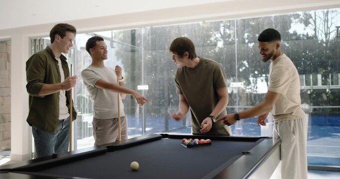 Diverse men gathering at black felt pool table, centered man placing rack, arranging balls for play