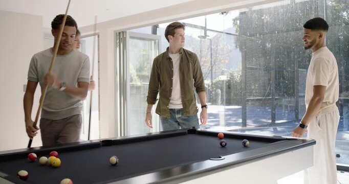 Diverse men after cue swap watching African-American man taking shots on black pool table for fun
