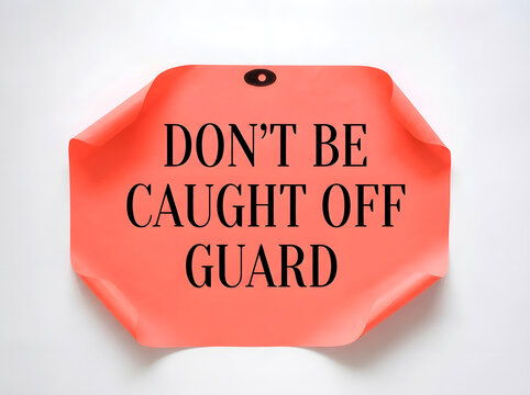 Don't Be Caught Off Guard Motivational Quote On Coral Hanging Paper Tag Isolated On White Background For Awareness, Preparation, Risk Management And Business Success Concept