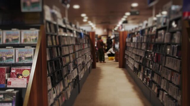 People browsing music cds and vinyl records in a store
