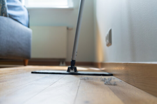 Flat floor mop ready to remove household dust from a wooden floor