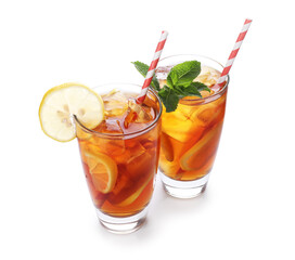 Fototapeta premium Refreshing ice tea with lemon and mint in glasses isolated on white