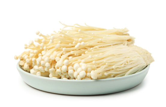 Clusters of raw enoki mushrooms isolated on white