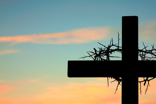 Crown of Thorns on Cross of Salvation Sunset Close Up Silhouette