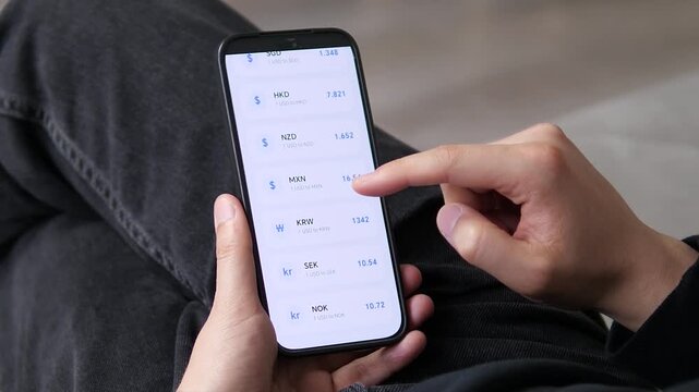 User reviewing an extended list of USD rates covering Asian and Scandinavian currencies. SGD, HKD, NZD, and KRW values displayed. Ideal for global finance, multi-currency portfolios, and international