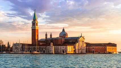beautiful view at Abbey of San Giorgio Maggiore from San Marco square in Venice, Italy. Venetian sunset landscape of antique architecture. © Yaroslav