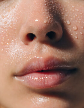 Extreme Close Up of Wet Skin with Glistening Water Droplets