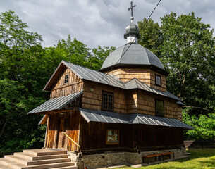 Old wooden Greek Catholic church with shingled roof and onion dome, rural Poland © Kamil