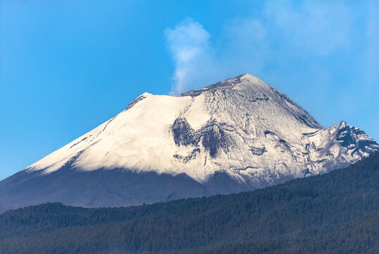 Snow-covered Popocatepetl volcano peak