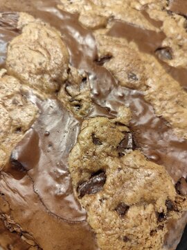 Top view of freshly baked brookie combining chocolate brownie and chocolate chip cookie texture