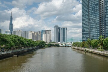 Obraz premium Waterfront towers at 2 Ton Duc Thang with Landmark 81 supertall skyscraper on horizon, Ho Chi Minh City, Vietnam