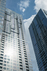 Obraz premium Low-angle architectural view of modern dark glass skyscrapers at 2 Ton Duc Thang development, Ho Chi Minh City, Vietnam