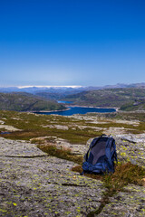 Fototapeta premium Backpack Overlooking Folgefonna and Mountain Lakes from Grindheimsnuten, Etne, Norway