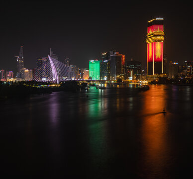 Ho Chi Minh City skyline at night with Ba Son Bridge, Landmark 81 and Bitexco Tower, Saigon River, Vietnam