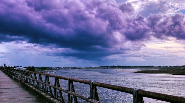 Bridge view over the Apalachicola River with dramatic purple storm clouds