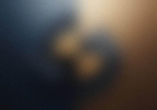 Abstract background with soft gradient blur in dark blue and warm golden tones.