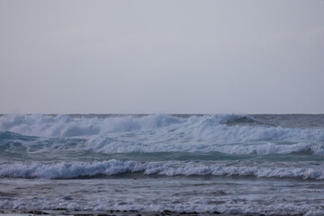 Churning Turquoise Sea Waves under Overcast Moody Sky in the Atlantic Ocean © Roman Bjuty