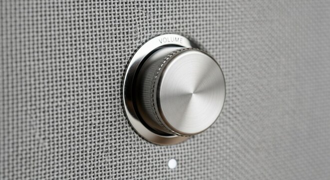 Brushed silver volume knob close-up view.