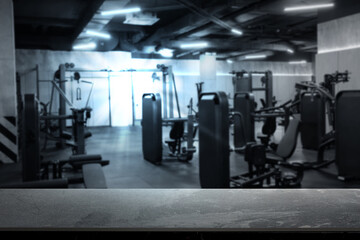 Fototapeta premium Empty stone surface in modern gym, selective focus. Space for design