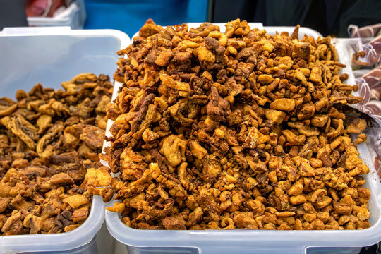 Homemade pork crackling pile traditional delicacy in Balkan crafted from pieces of pork fat cut into small chunks sold on local market